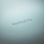 refurbished macbook - a close up of a macbook pro logo
