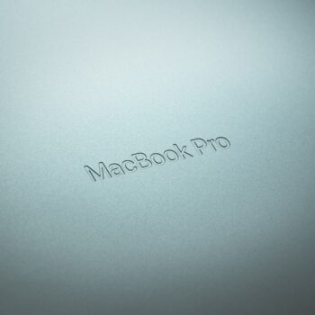 refurbished macbook - a close up of a macbook pro logo