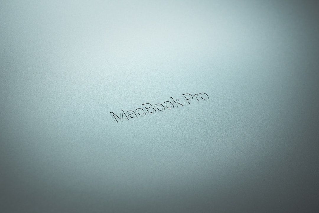 refurbished macbook - a close up of a macbook pro logo