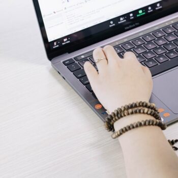 second hand laptop - person using black and silver laptop computer