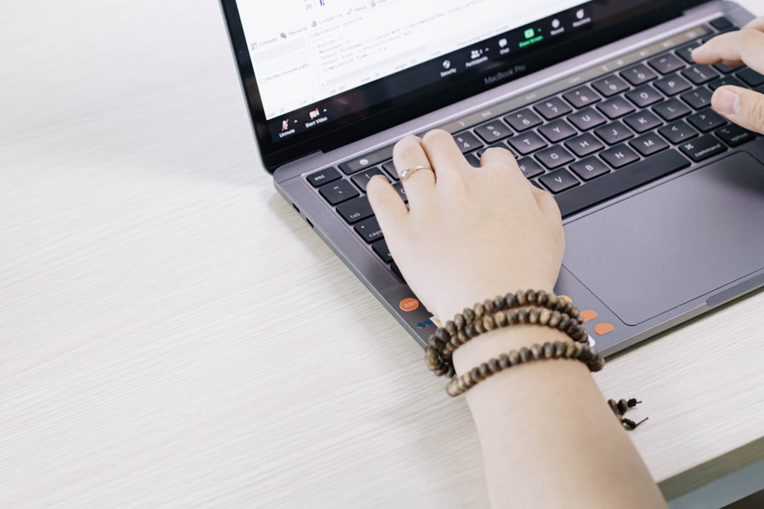 second hand laptop - person using black and silver laptop computer