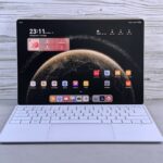 laptop price under 10000 - A modern tablet with a white keyboard attachment.