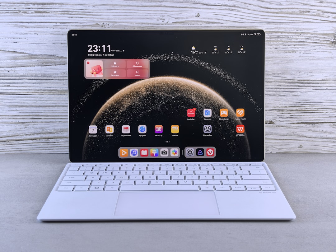 laptop price under 10000 - A modern tablet with a white keyboard attachment.