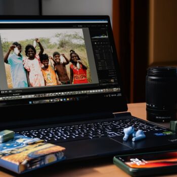 ssd vs hdd laptop india - A laptop computer sitting on top of a wooden desk