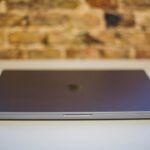 macbook air m1 refurbished - a close up of a laptop on a table