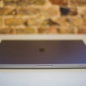 macbook air m1 refurbished - a close up of a laptop on a table