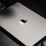 macbook refurbished - a black cell phone