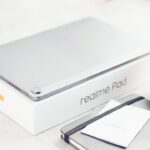 refurbished gaming laptop India under 50000 - a laptop computer sitting on top of a table next to a cup