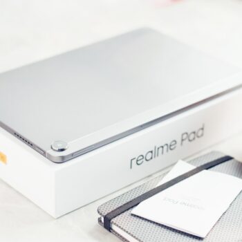 refurbished gaming laptop India under 50000 - a laptop computer sitting on top of a table next to a cup