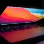 best laptop under 20000 - a laptop computer sitting on top of a desk