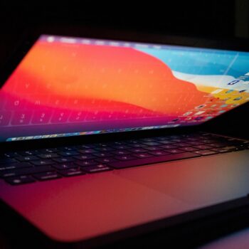 best laptop under 20000 - a laptop computer sitting on top of a desk