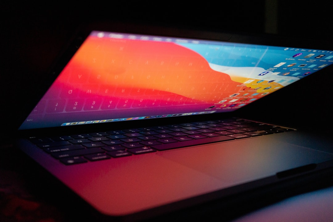 best laptop under 20000 - a laptop computer sitting on top of a desk