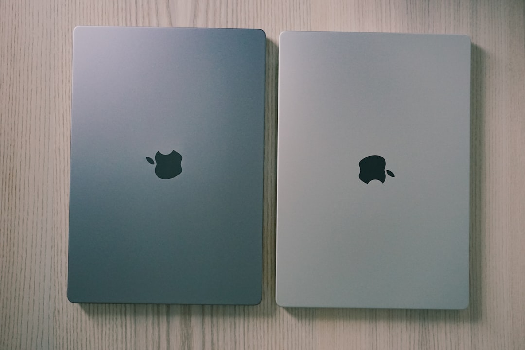 M5 vs M4 chip comparison - two silver ipads side by side on a wooden surface