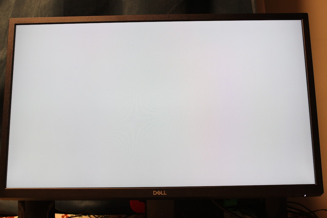 dell latitude 5420 - A big screen TV sitting on top of a wooden stand