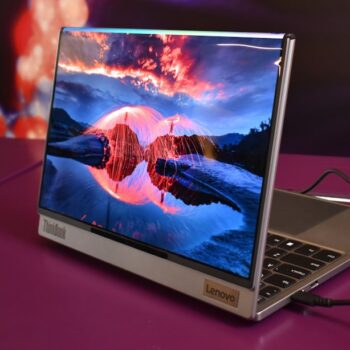 second hand lenovo laptop - Modern laptop displaying a vibrant landscape on screen.