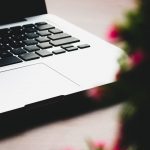 MacBook Pro near plant