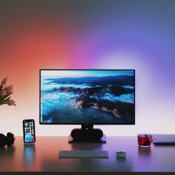 black flat screen computer monitor on brown wooden desk