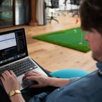 Man working on a laptop in an office