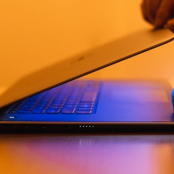 a person using a laptop computer on a desk