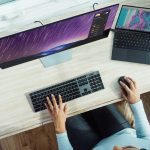 person using laptop on table