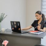 Woman working on a laptop at a desk